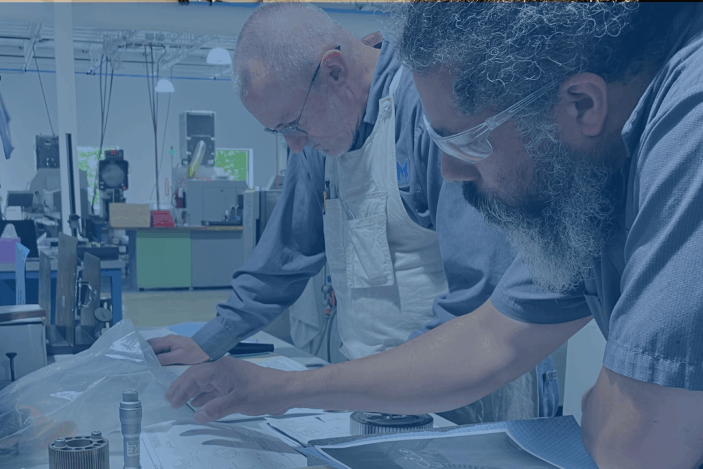 Two men looking over a blueprint