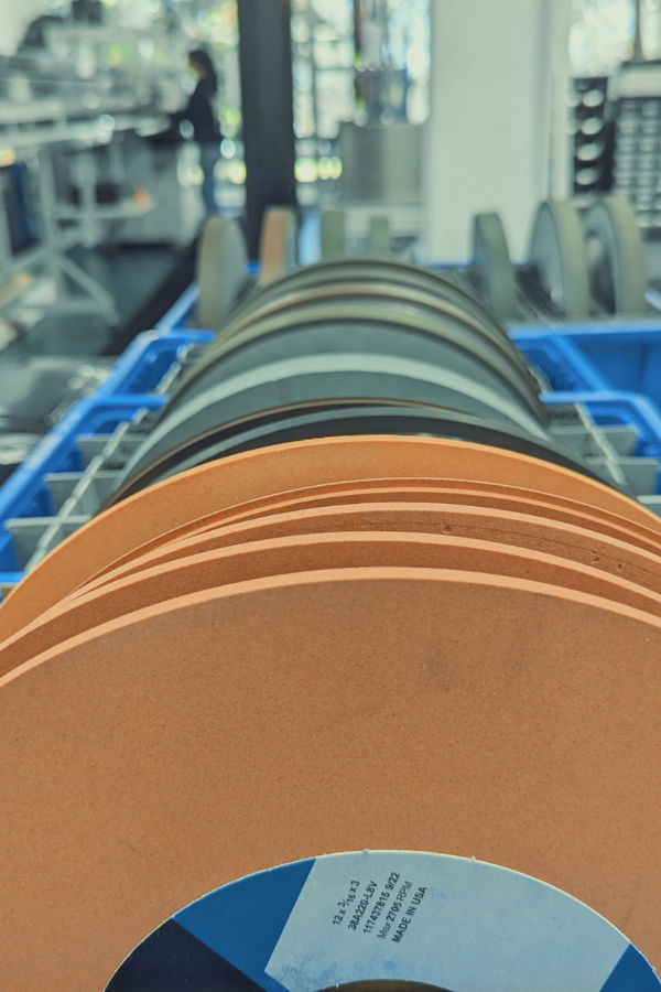 Grinding wheel abrasive grain structure that determines achievable corner radii in precision grinding.”