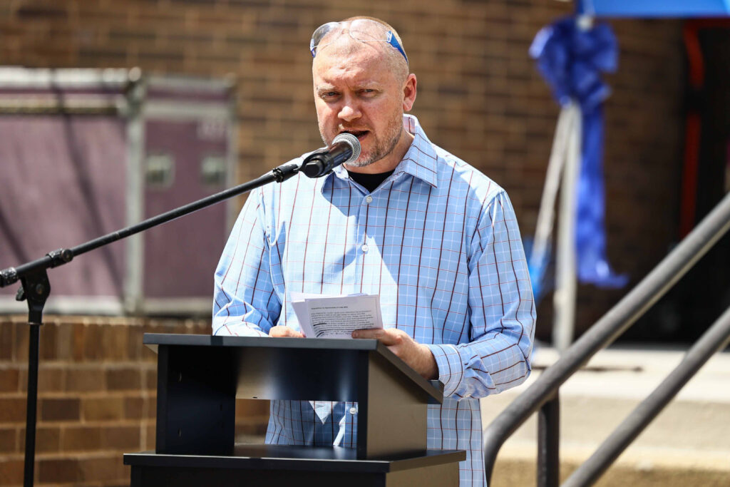 Steve Dierkes emcees at KMM Group Ribbon Cutting