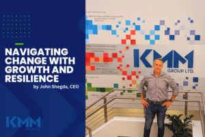 John Shegda, CEO KMM Group in front of KMM history timeline